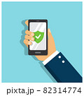 A man's hand holds a phone protected by a strong password and a green sign with a check mark on the screen  82314774