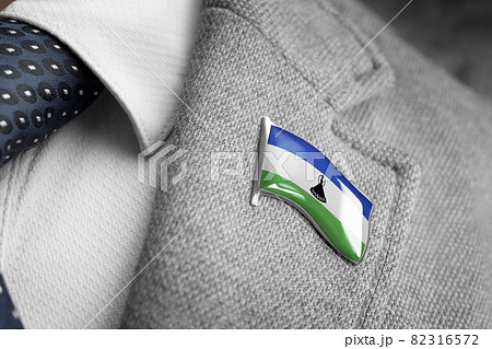 Metal badge with the flag of Lesotho on a suit lapel 82316572