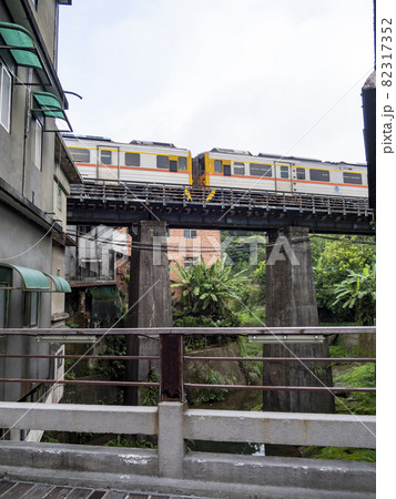 Train of Pingxi Railway Line traveling in Pinghsi old street, New Taipei City, Taiwan 82317352