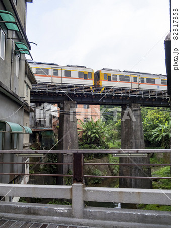 Train of Pingxi Railway Line traveling in Pinghsi old street, New Taipei City, Taiwan 82317353