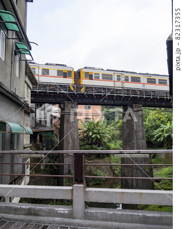 Train of Pingxi Railway Line traveling in Pinghsi old street, New Taipei City, Taiwan 82317355