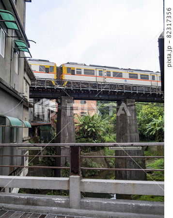 Train of Pingxi Railway Line traveling in Pinghsi old street, New Taipei City, Taiwan 82317356