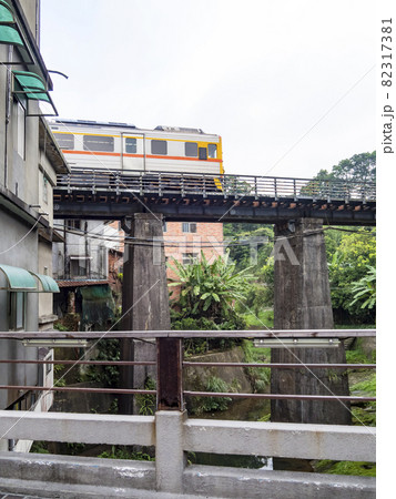 Train of Pingxi Railway Line traveling in Pinghsi old street, New Taipei City, Taiwan 82317381
