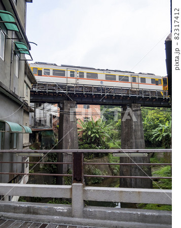 Train of Pingxi Railway Line traveling in Pinghsi old street, New Taipei City, Taiwan 82317412