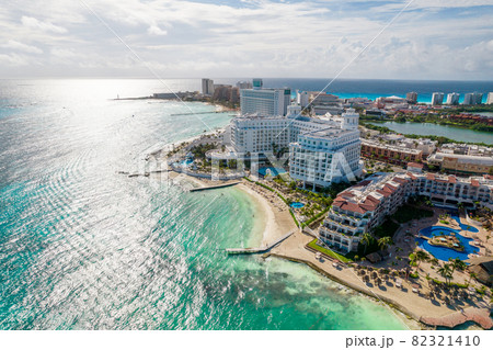 Aerial panoramic view of Cancun beach and city hotel zone in Mexico. Caribbean coast landscape of Mexican resort with beach Playa Caracol and Kukulcan road. Riviera Maya in Quintana roo region on 82321410