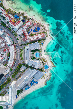 Aerial top view of Cancun beach and city hotel zone in Mexico. Caribbean coast landscape of Mexican resort with beach Playa Caracol and Kukulcan road. Riviera Maya in Quintana roo region on Yucatan 82321443