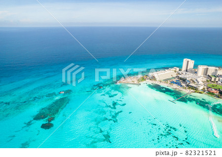 Aerial panoramic view of Cancun beach and city hotel zone in Mexico. Caribbean coast landscape of Mexican resort with beach Playa Caracol and Kukulcan road. Riviera Maya in Quintana roo region on 82321521