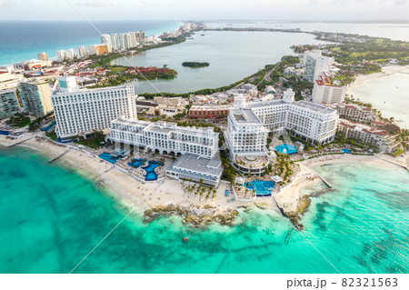 Aerial panoramic view of Cancun beach and city hotel zone in Mexico. Caribbean coast landscape of Mexican resort with beach Playa Caracol and Kukulcan road. Riviera Maya in Quintana roo region on 82321563