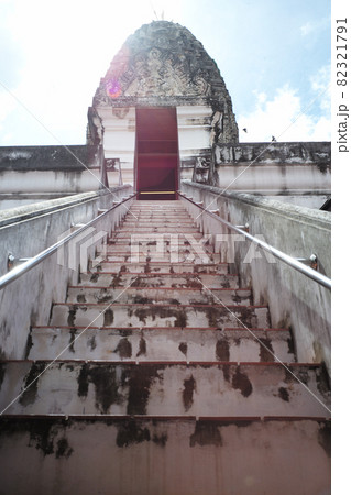 High angle view of ancient pagoda with steps in foreground and flare sunlight in background High angle view of ancient pagoda with steps in foreground and flare sunlight in background 82321791