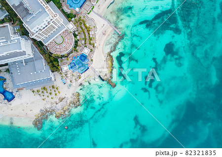 Aerial top view of Cancun beach and city hotel zone in Mexico. Caribbean coast landscape of Mexican resort with beach Playa Caracol and Kukulcan road. Riviera Maya in Quintana roo region on Yucatan Aerial top view of Cancun beach and city hotel zone in Mexico. Caribbean coast landscape of Mexican resort with beach Playa Caracol and Kukulcan road. Riviera Maya in Quintana roo region on Yucatan 82321835