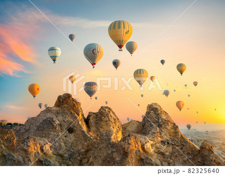 Hot air balloons over rocks 82325640