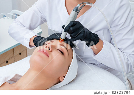 Face Skin Care. Closeup Of Woman Face Cleansing At Cosmetology clinic, vacuum cleaning Face Skin Care. Closeup Of Woman Face Cleansing At Cosmetology clinic, vacuum cleaning 82325794