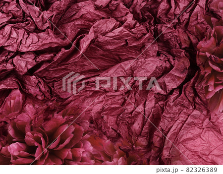 Crumpled red tissue paper and peony flowers Crumpled red tissue paper and peony flowers 82326389