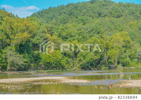 The Current River flows through the Mountains of Ozark National Scenic Riverway of Round Spring, Shannon County, Missouri The Current River flows through the Mountains of Ozark National Scenic Riverway of Round Spring, Shannon County, Missouri 82336694