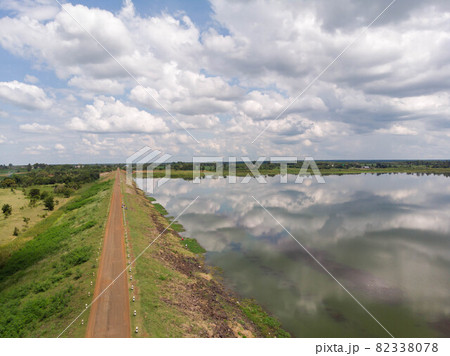 Drone shot aerial view scenic landscape of river reservoir dam and the forest 82338078