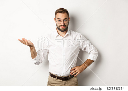 Confused office worker shrugging, cant understand something, standing over white background Confused office worker shrugging, cant understand something, standing over white background 82338354