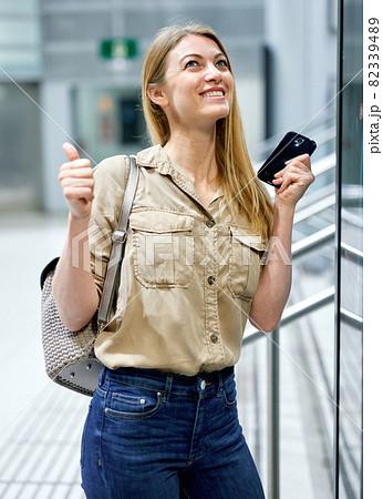 Young woman traveler looking at itinerary map at metro station 82339489