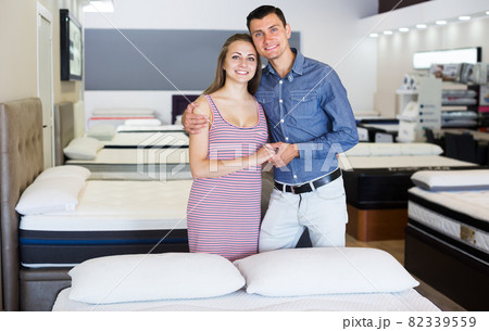 Family couple in furniture store 82339559