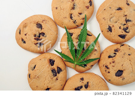 Sweets with CBD oil. Marijuana leaf on white background. 82341129