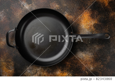 Large frying pan with copy space for text or food with copy space for text or food, top view flat lay , on old dark rustic table background 82343860