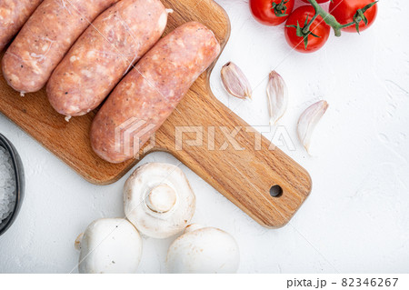 Traditional raw pork sausages, flat lay, on white background 82346267