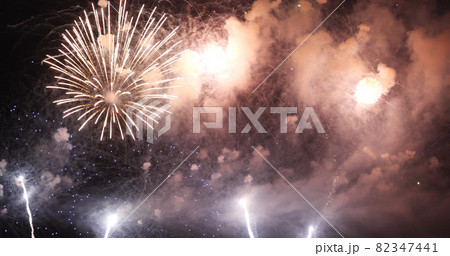 Golden Firework celebrate anniversary happy new year 2022, 4th of july holiday festival. Gold firework in the night time celebrate national holiday. Countdown to new year 2022 gold party time event 82347441