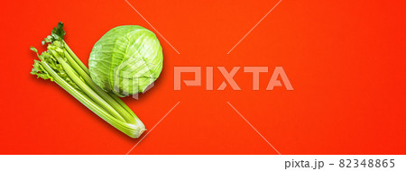 Celery branch bunch and green cabbage isolated on red banner 82348865