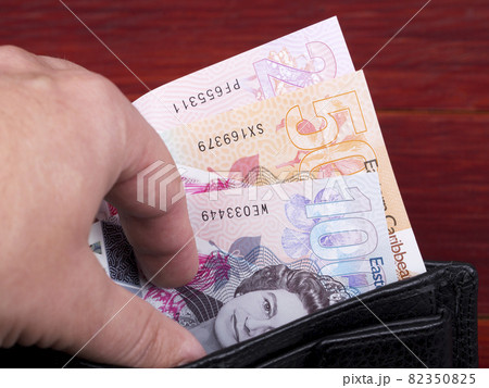 Eastern Caribbean money - dollar in the black wallet Eastern Caribbean money - dollar in the black wallet 82350825