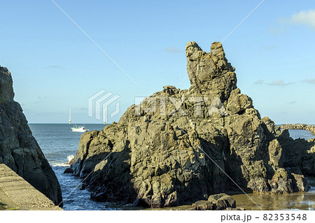 千葉県 銚子市 朝日があたる犬岩の写真素材