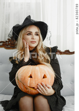 Woman in costume getting ready for halloween 82360789