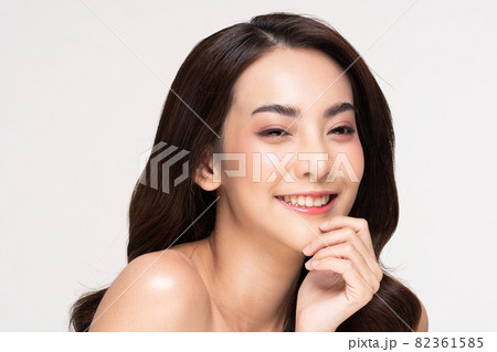 Beautiful Asian woman looking at camera smile with clean and fresh skin Happiness and cheerful with positive emotional,isolated on white background,Beauty and Cosmetics Concept 82361585