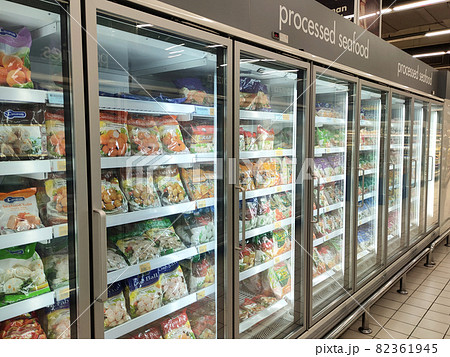 KUALA LUMPUR, MALAYSIA -MARCH 9, 2020: Frozen foods are displayed on the rack inside the large chiller in the supermarket. Displayed and arranged by the brand to make it easy for the customer.  82361945