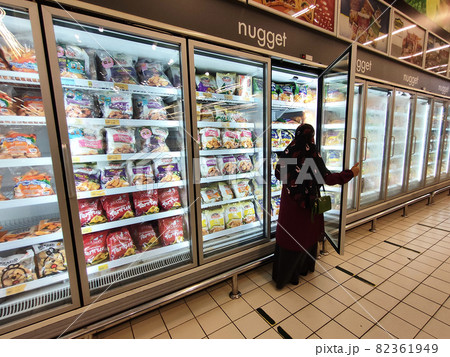 KUALA LUMPUR, MALAYSIA -MARCH 9, 2020: Frozen foods are displayed on the rack inside the large chiller in the supermarket. Displayed and arranged by the brand to make it easy for the customer.  82361949