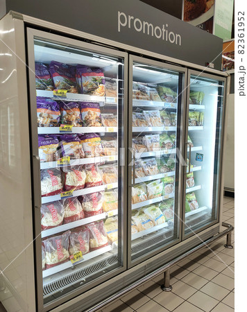 KUALA LUMPUR, MALAYSIA -MARCH 9, 2020: Frozen foods are displayed on the rack inside the large chiller in the supermarket. Displayed and arranged by the brand to make it easy for the customer. KUALA LUMPUR, MALAYSIA -MARCH 9, 2020: Frozen foods are displayed on the rack inside the large chiller in the supermarket. Displayed and arranged by the brand to make it easy for the customer. 82361952