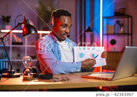 African american man in headset having video call on laptop 82363067