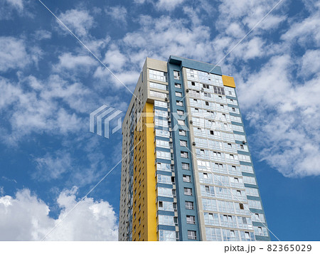 Modern beautiful new buildings. Colored wall on the background of blue sky. 82365029