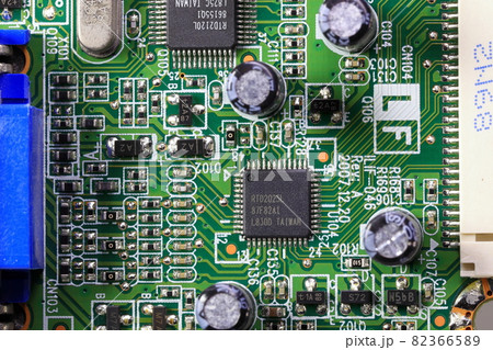 Old Printed Circuit Board with many electrical components. Old Printed Circuit Board with many electrical components. 82366589