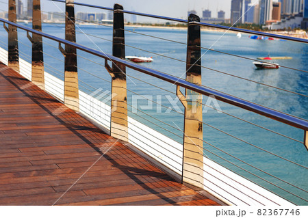 Pedestrian hanging bridge over sea in Dubai Marina Pedestrian hanging bridge over sea in Dubai Marina 82367746