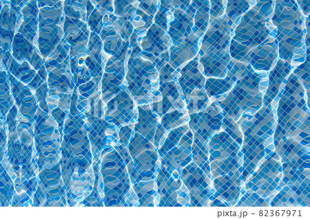 Swimming pool mosaic bottom caustics ripple like sea water and flow with waves background with sun light reflection 82367971