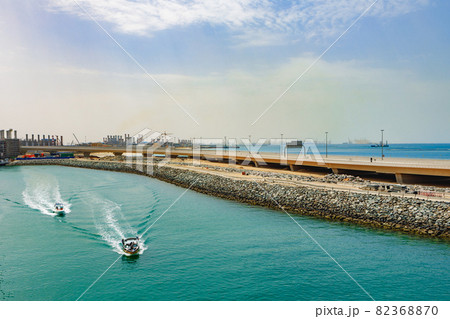 View of speed motor boat going on high speed near coast line 82368870