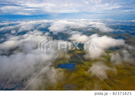Flying in the sky above the clouds. Aerial photography.  82371625