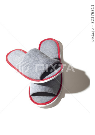 Gray one-off slippers for hotel on a white background Gray one-off slippers for hotel on a white background 82376811
