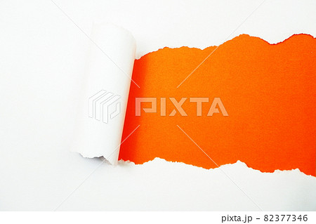 Paper torn with space copy on orange background Paper torn with space copy on orange background 82377346