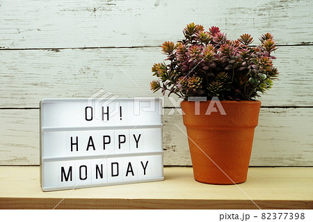 Happy Monday lightbox alphabet wording on wooden background Happy Monday lightbox alphabet wording on wooden background 82377398