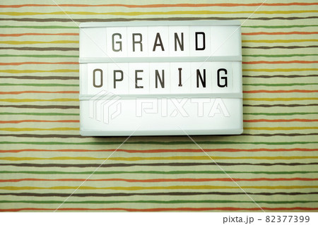 Top view Grand opening word in light box flat lay with space copy Top view Grand opening word in light box flat lay with space copy 82377399