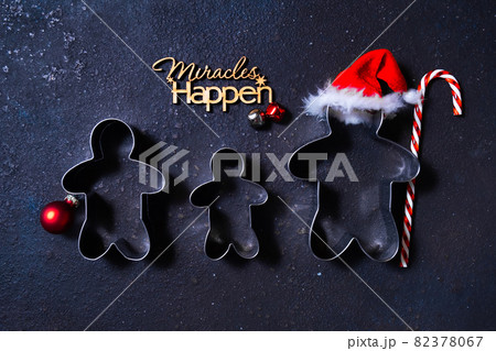 Christmas cookie cutters in shape of gingerbread mans. Happy family holidays concept. 82378067