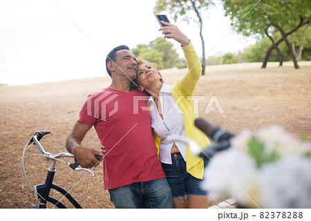 Portrait of happy mature dates taking selfie 82378288