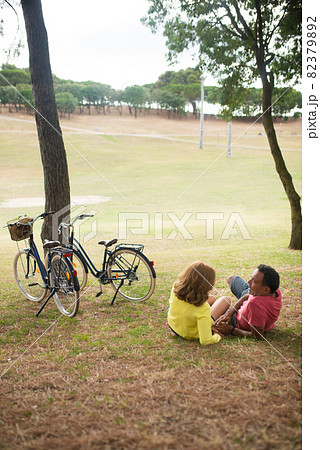 Happy mature couple resting in autumn park Happy mature couple resting in autumn park 82379892