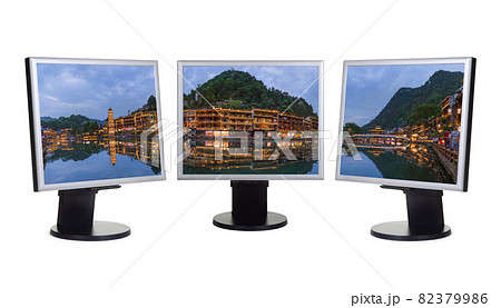 Panorama of ancient town Fenghuang in China (my photo) on computer monitors 82379986