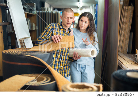 Married couple chooses a carpet in hardware store 82380957